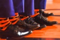 Black shoes and orange socks