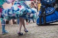 Legs and blue dress of Costumed woman at the Venetian Parade in Riquewihr in Alsace