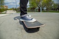 Legs and the board skateboarder at start. Close-up.