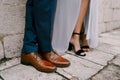 Legs of the bride and groom in wedding shoes. Close-up Royalty Free Stock Photo