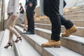 legs of businessmen walk stepping down stair in modern city hurry time, rush hour to work .business concept Royalty Free Stock Photo