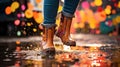 legs of child in blue rubber boots jumping in autumn puddles