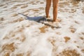 Legs of children stand on the beach Royalty Free Stock Photo