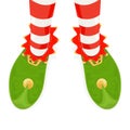 Legs of Christmas elf in green shoes Royalty Free Stock Photo