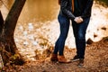 Legs. man and woman hug in autumn Park near river Royalty Free Stock Photo