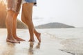 Legs of  couple stand together on beach. Man and woman in love Royalty Free Stock Photo