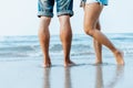 Legs of  couple stand together on beach. Man and woman in love Royalty Free Stock Photo