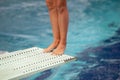 Legs on a diving board Royalty Free Stock Photo