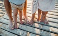 Legs and feet of family standing on beach on summer holiday, a midsection. Royalty Free Stock Photo