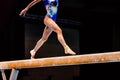 legs female gymnast exercise balance beam gymnastics on dark background Royalty Free Stock Photo