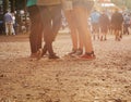 Legs, forest and group of people at festival together for social event, party or summer celebration. Flare, crowd and