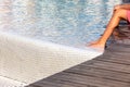 Legs in a fountain, Child cooling its feet in fresh water. Summer in the city. Poznan, Poland Royalty Free Stock Photo