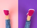 Legs of the girl in red sneakers and ripped jeans on the purple and pink floor. The view from the top. Royalty Free Stock Photo