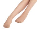 Legs of a girl in transparent tights isolated on a white background Royalty Free Stock Photo