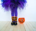 The legs of a girl in a witch costume. Royalty Free Stock Photo