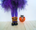 The legs of a girl in a witch costume. Royalty Free Stock Photo