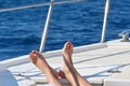 Legs of a girl on the yacht deck Royalty Free Stock Photo