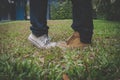 Legs of girlfriend standing on tiptoe close to boyfriend outdoor