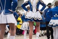 legs of girls with sexy costume of cheerleader parading in the street Royalty Free Stock Photo