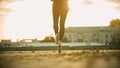 Legs of graceful young woman ballerina running on the roof on her tiptoes - sunset Royalty Free Stock Photo