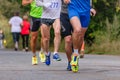 legs group athletes runners running race on road