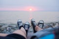 The legs of a guy and a girl in the evening on the beach Royalty Free Stock Photo