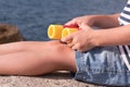 Legs and hands a little boy in shorts holding binoculars on sea background Royalty Free Stock Photo