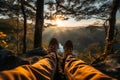 Legs of a hiker admiring a scenic view from a mountain top. Hiking and trekking on a nature trail. Traveling by foot