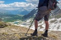 hiker standing at the top of mountain with beautiful alpine landscape Royalty Free Stock Photo
