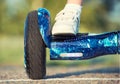 The boy is riding on a balance board.Legs on hover board. Royalty Free Stock Photo