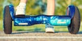 The boy is riding on a balance board.Legs on hover board. Royalty Free Stock Photo
