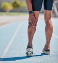 Legs injury for man running on track for cardio workout, sprint competition or marathon race. Muscle pain, calf problem