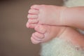 Legs a little baby in basket Royalty Free Stock Photo