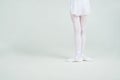 Legs of little young ballerina poses on camera Royalty Free Stock Photo