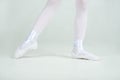 Legs of little young ballerina poses on camera Royalty Free Stock Photo