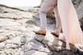 Legs of lovers man and women standing on the rocks next to each other, close-up Royalty Free Stock Photo