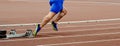 legs male sprinter runner start running in starting blocks