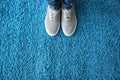 Legs of man in casual shoes on carpet Royalty Free Stock Photo