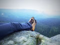Legs of a man on rock. Hiker resting in boots for mountain Royalty Free Stock Photo