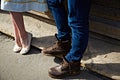 Legs of a man and a woman standing close by Royalty Free Stock Photo