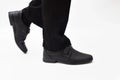 Legs in men`s black trousers and classic shoes Royalty Free Stock Photo