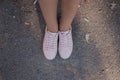 Legs in pink sneakers on the pavement Royalty Free Stock Photo