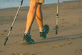 Legs and poles of nordic walker old woman Royalty Free Stock Photo