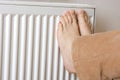 Legs on radiator Royalty Free Stock Photo