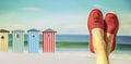 Legs with red cloth shoes in front of beach Royalty Free Stock Photo