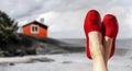 Legs with red cloth shoes in front of beach Royalty Free Stock Photo