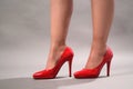 A woman`s legs with red high heels shoes Royalty Free Stock Photo