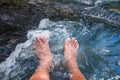 Legs relaxing waterfall plunge Royalty Free Stock Photo