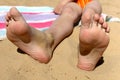 Legs on a river beach