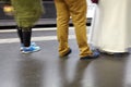 Legs and shoes of people waiting for a train. Royalty Free Stock Photo